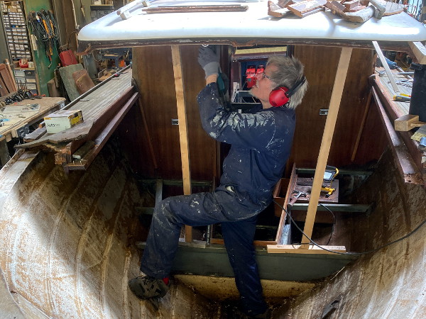 A boat in the workshop, being worked on